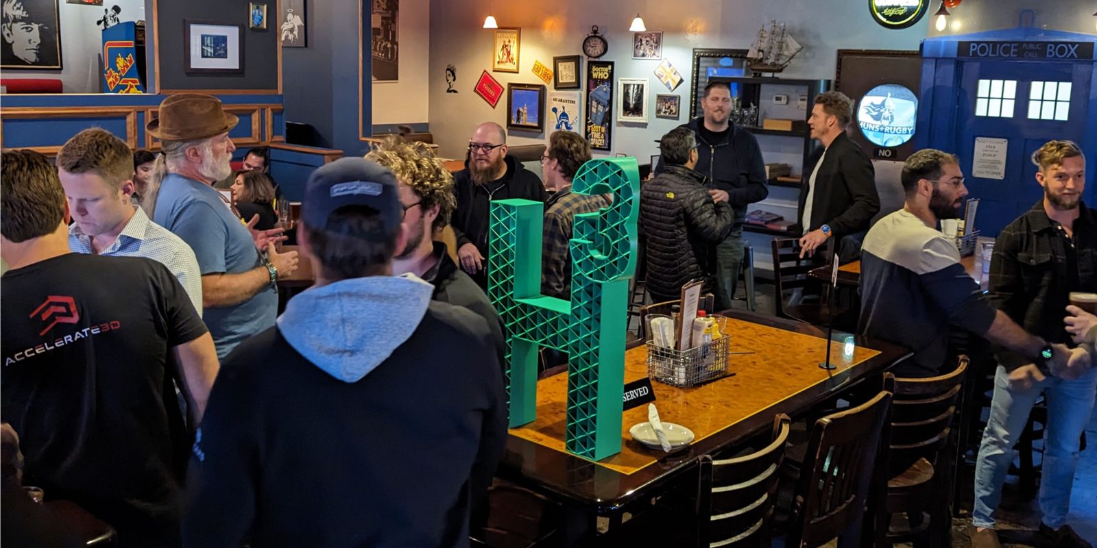 H³ ATX crowd gathered around the H³ sign at a happy hour